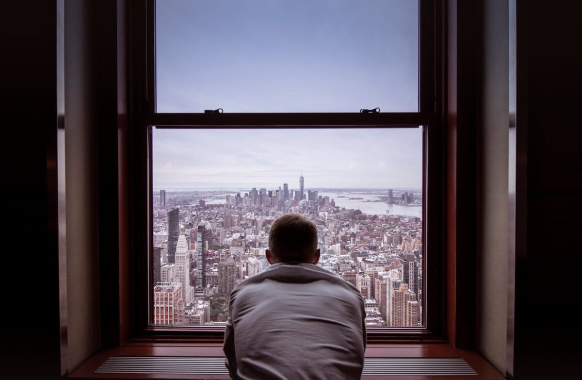 man looking through the window